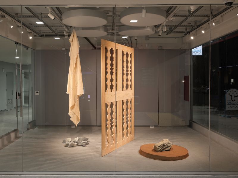 wooden art surrounded by gray