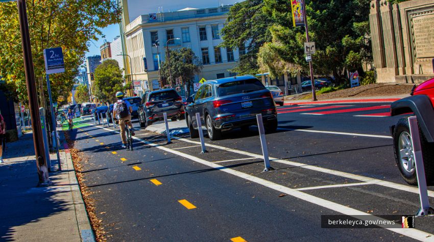 Bicyclists riding on a protected bike lane on Bancroft Way