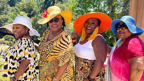 Women wearing colorful hats